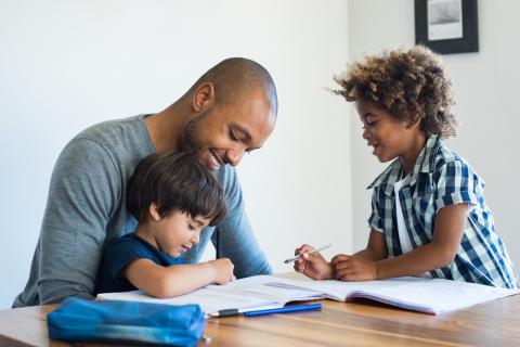 A father enjoys a visit with his children.