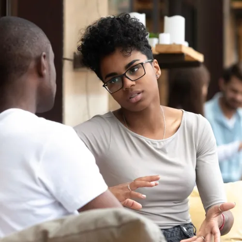 Man and woman talking seriously. 