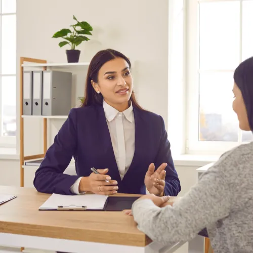 Attorney meeting with her client.