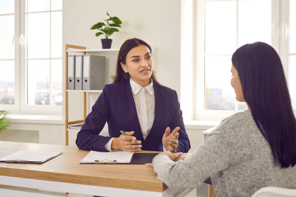 Attorney meeting with her client.